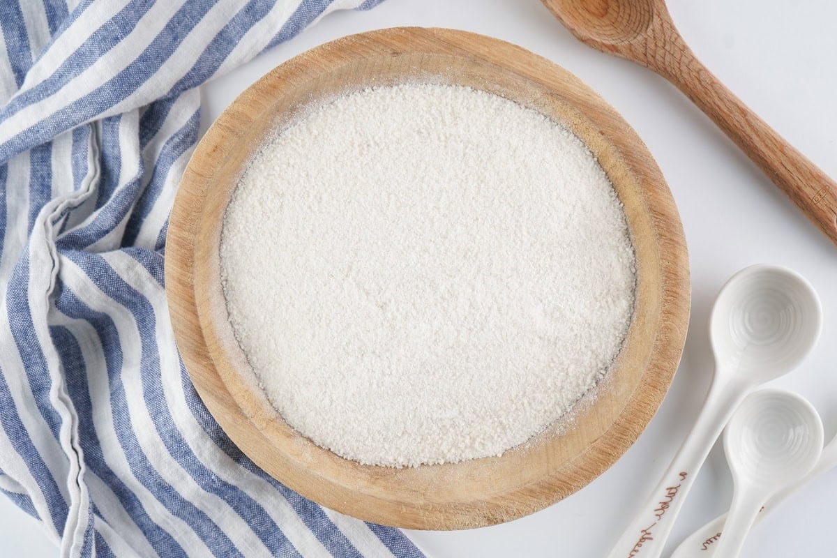 A wooden bowl of flour.