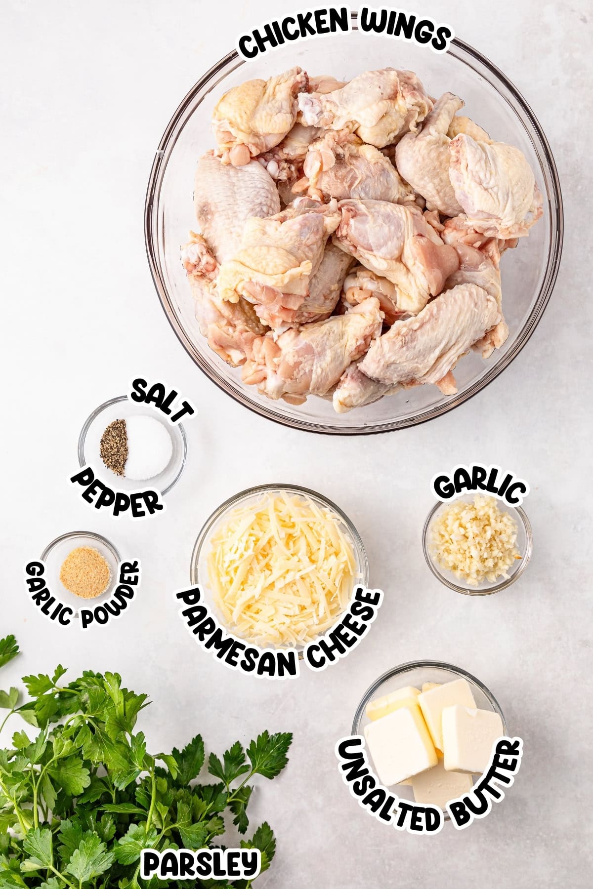 Ingredients for a chicken wings recipe arranged on a table.