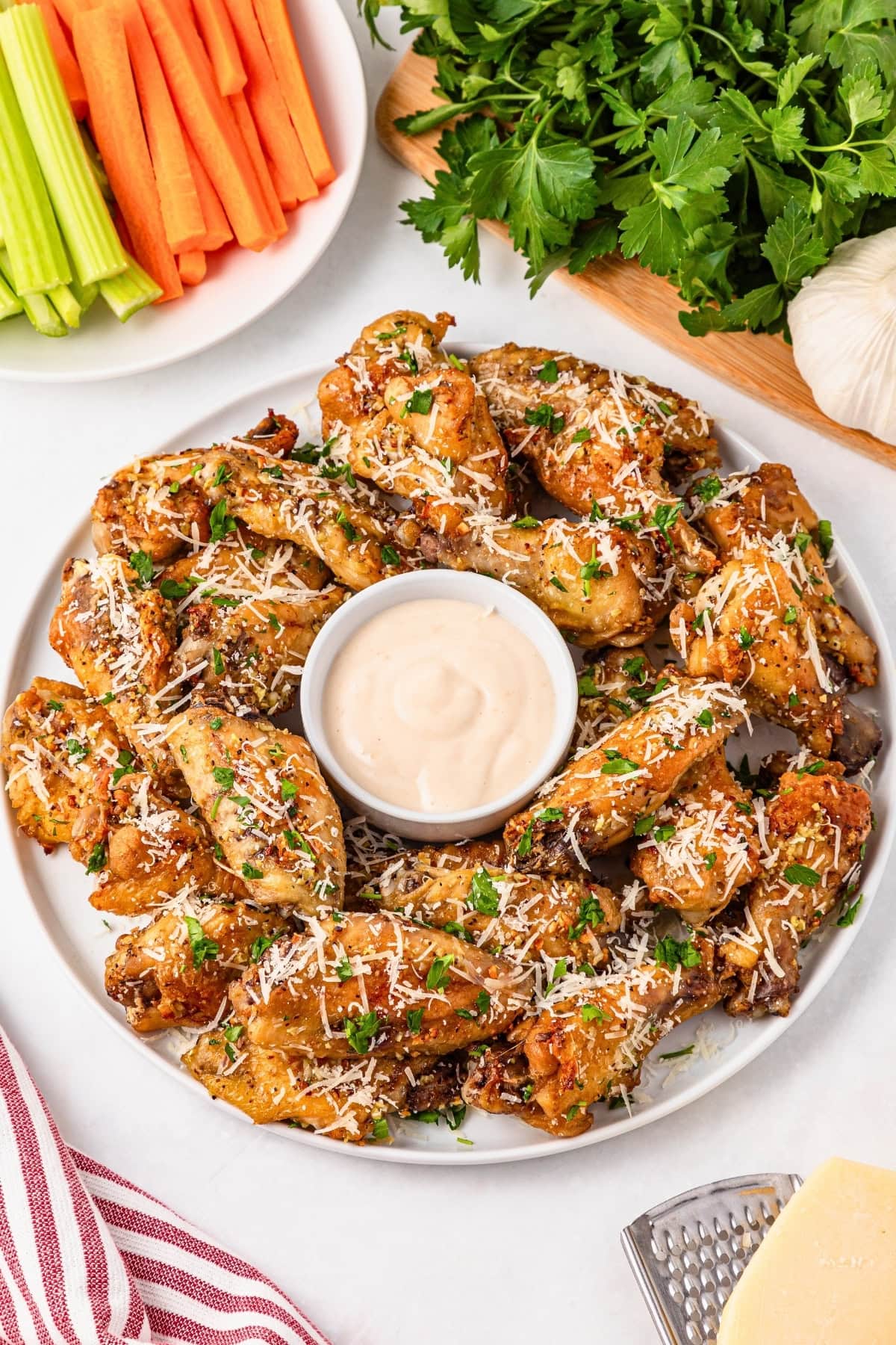 Plate of chicken wings with dip.