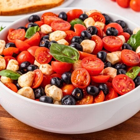 4th of July salad with cherry tomatoes, mozzarella, olives, and fresh basil.