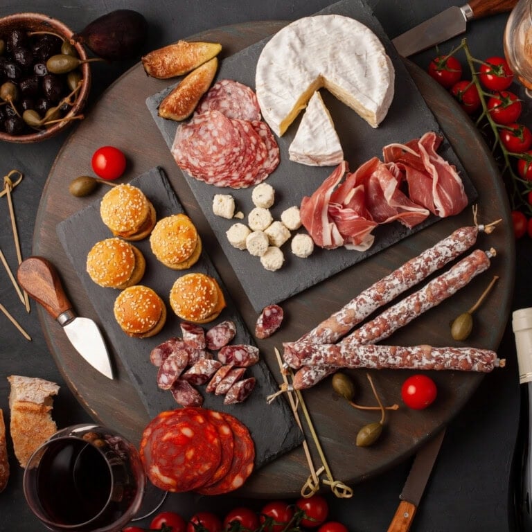 Simple platter ideas: Charcuterie board with meats, cheeses, figs, and crackers.