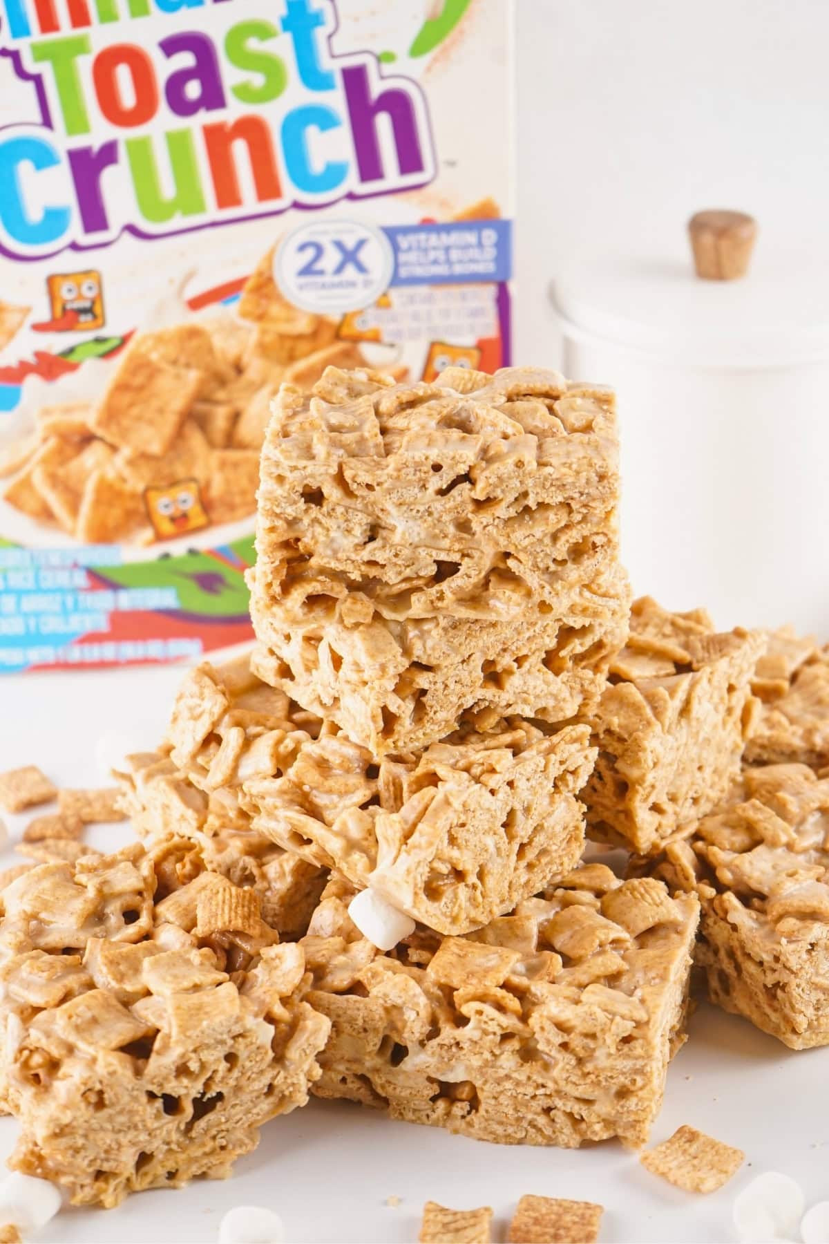 Stacked cereal treats made with Cinnamon Toast Crunch and marshmallows.