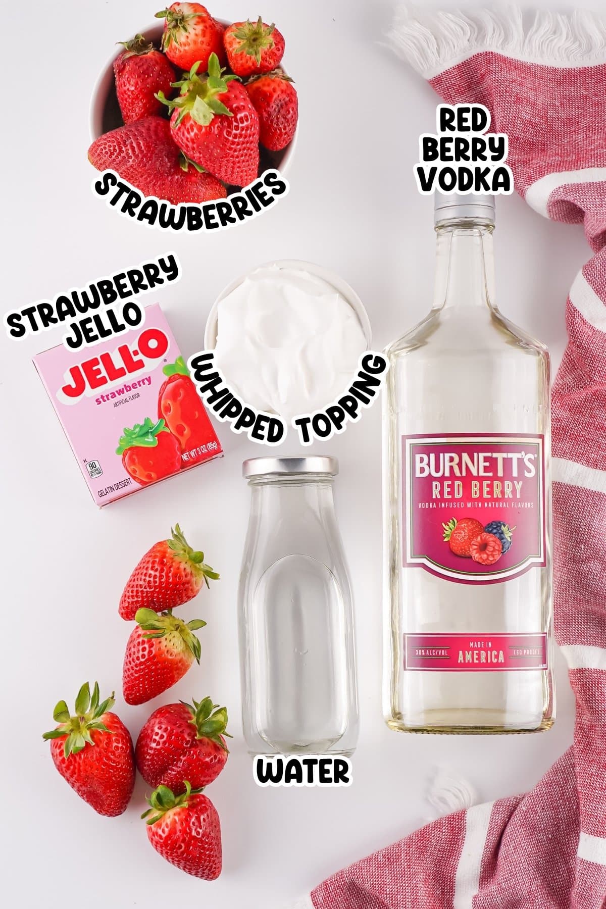 Strawberries, strawberry Jello, whipped topping, water, and red berry vodka.
