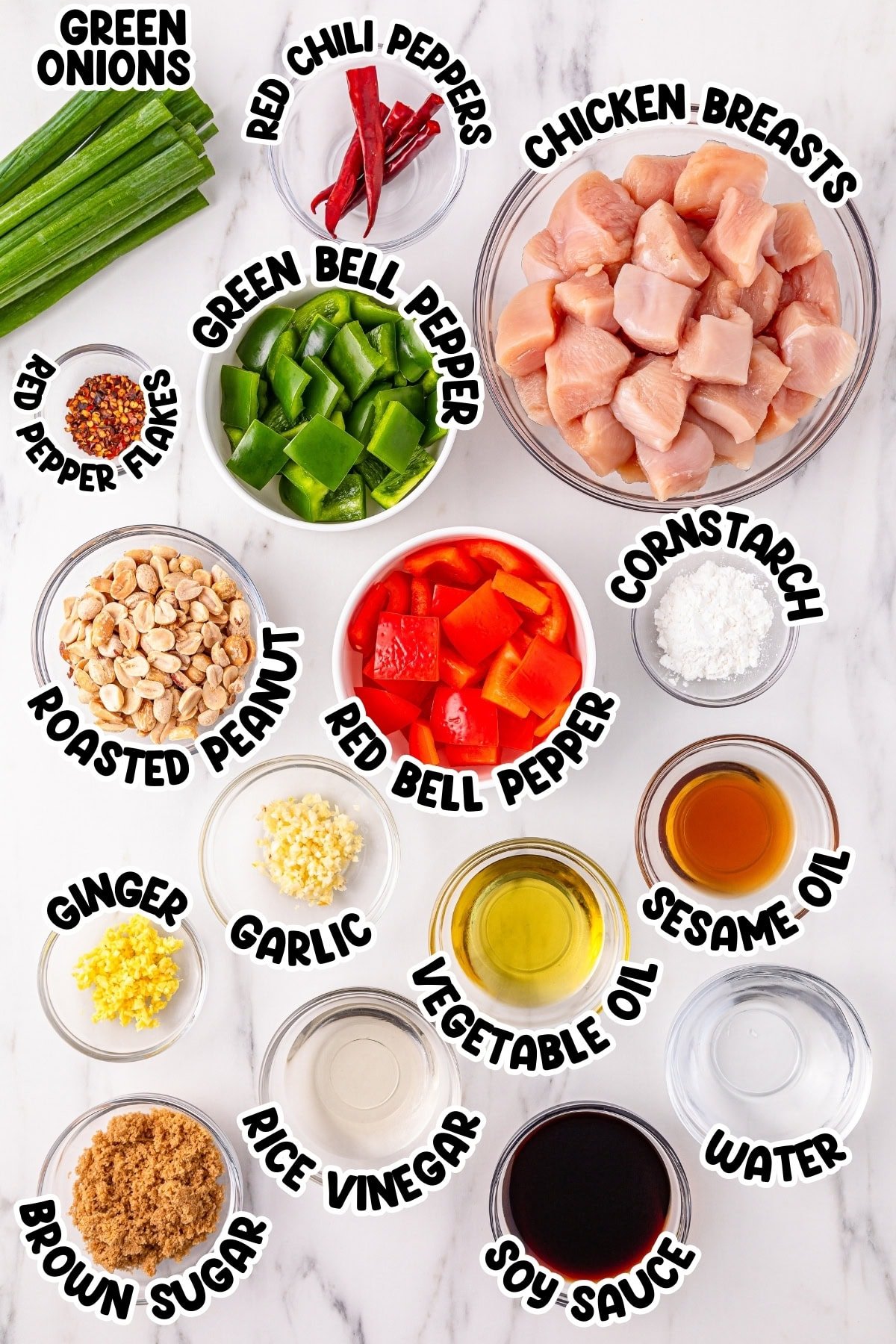 Kung pao chicken ingredients in separate bowls.