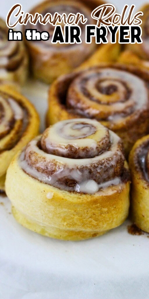 Freshly baked cinnamon rolls with icing.