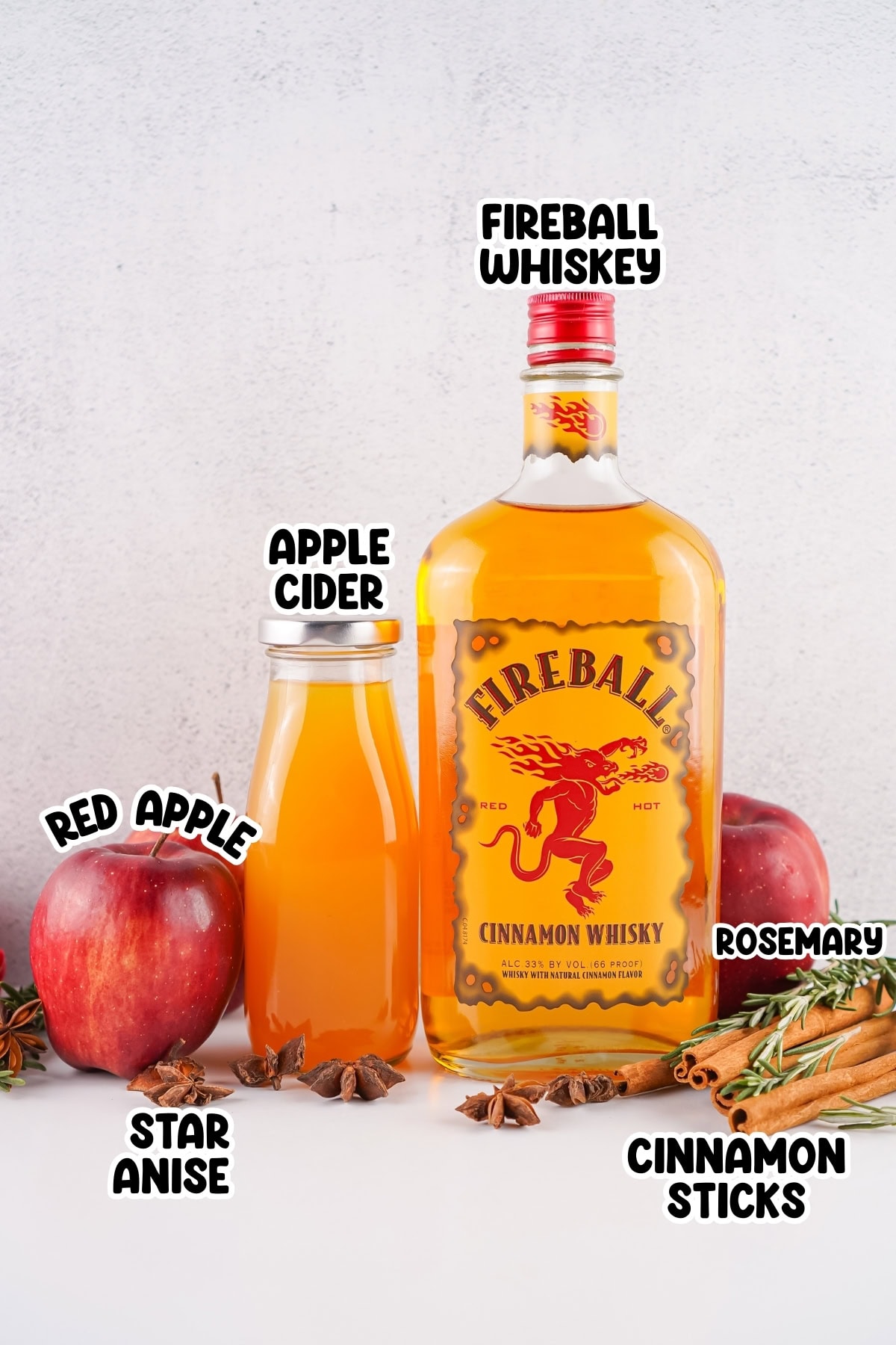 Fireball whiskey, apple cider, apples, rosemary, star anise, and cinnamon sticks.