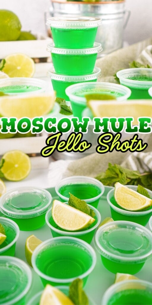 Green jello shots in small cups, garnished with lime wedges and mint leaves.