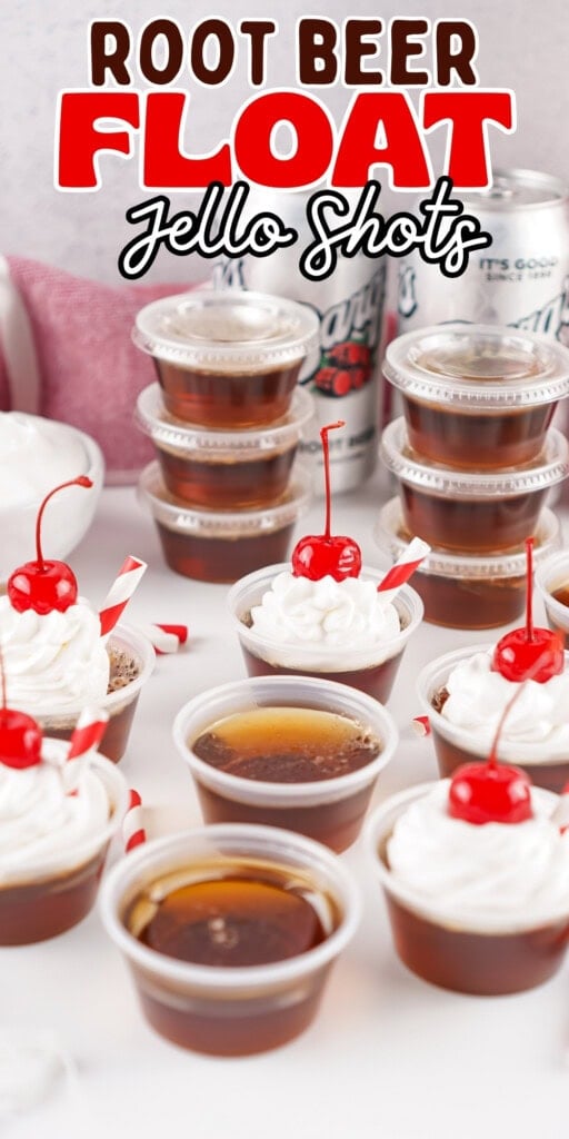 Small cups of root beer float jello shots topped with whipped cream and cherries.