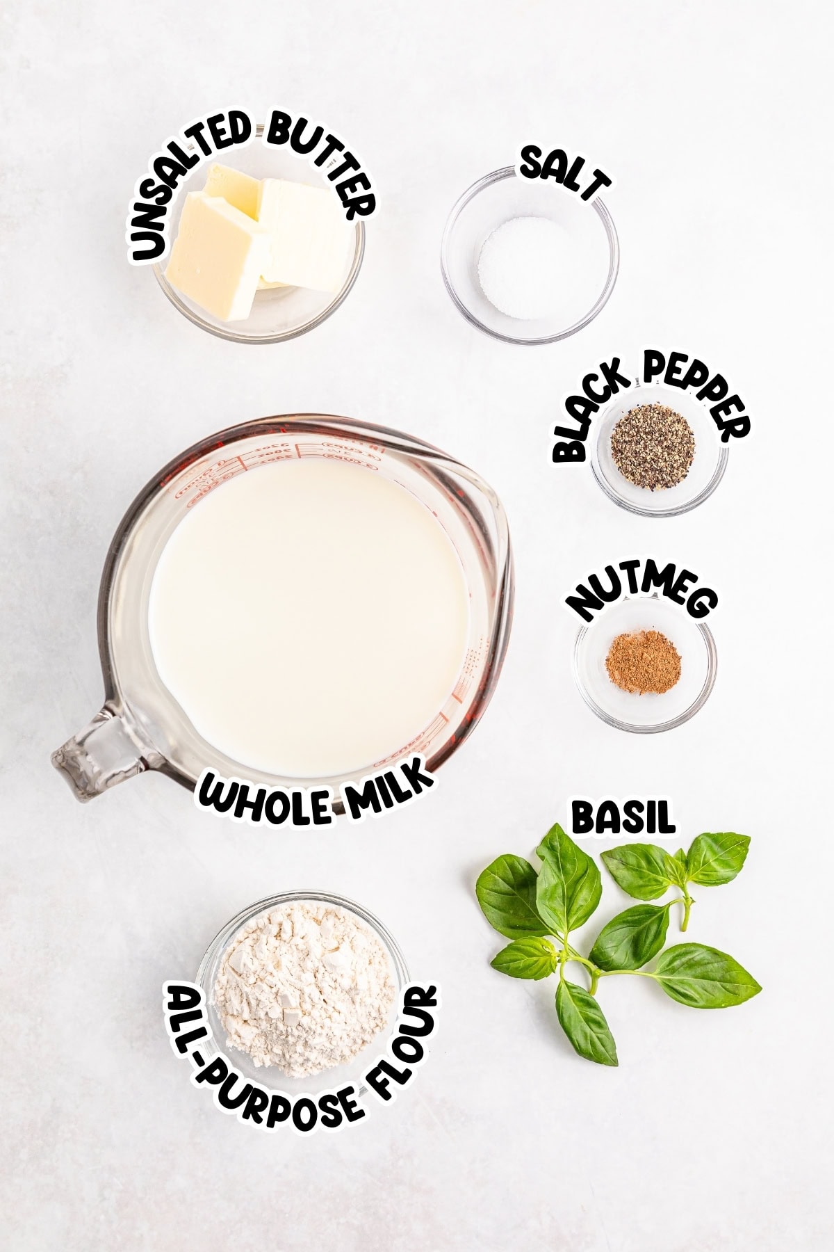 Butter, milk, flour, salt, pepper, nutmeg, and basil.