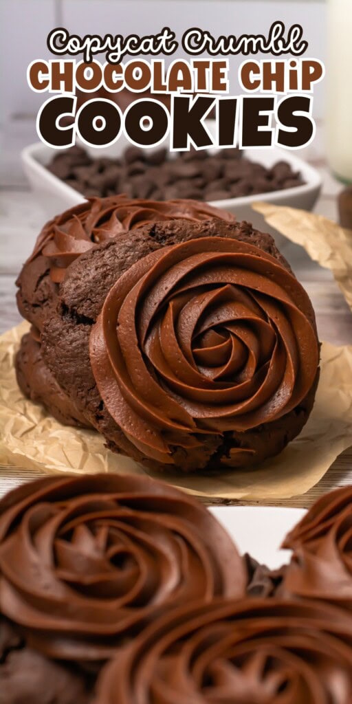 Chocolate chip cookies with chocolate frosting swirls on parchment paper.