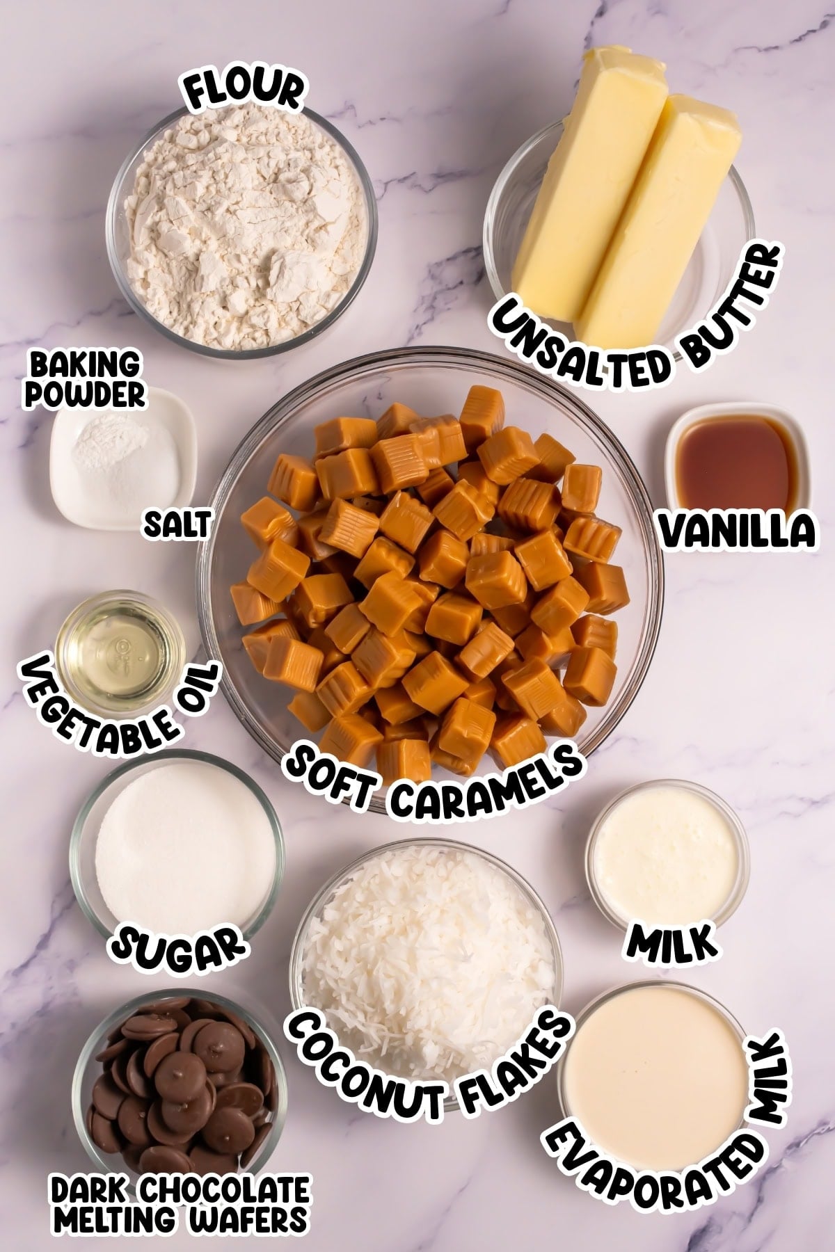 Baking ingredients: flour, butter, caramels, coconut, milk, chocolate.