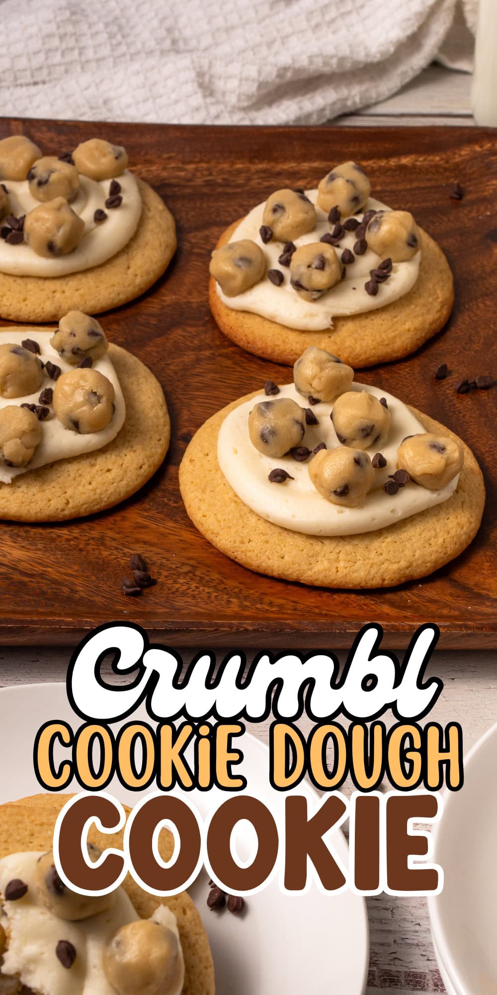 Four frosted cookies topped with cookie dough balls and mini chocolate chips.