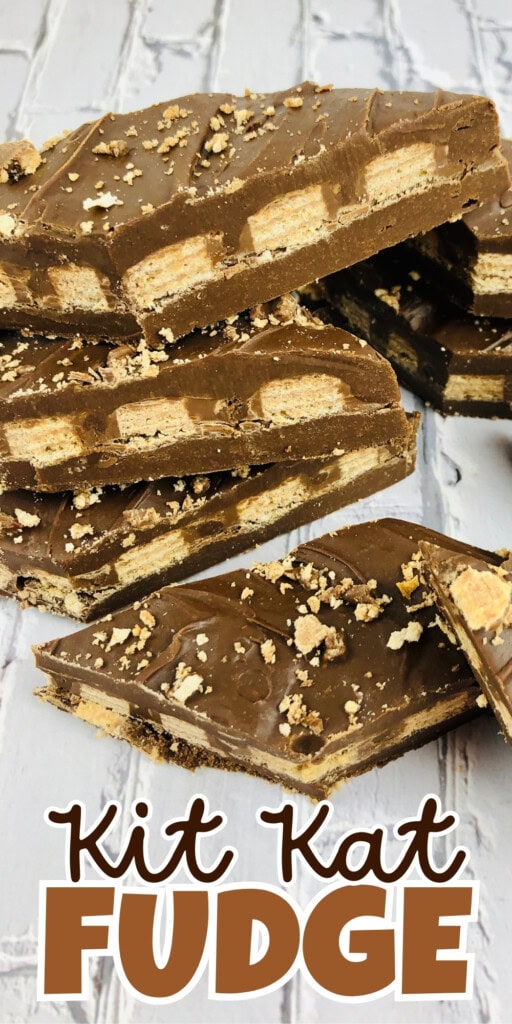 Stacked pieces of Kit Kat fudge with chocolate and wafer layers.
