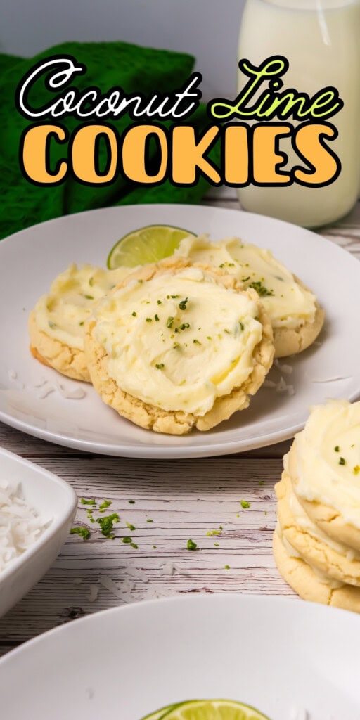 A plate of frosted coconut lime cookies with lime zest and a glass of milk.