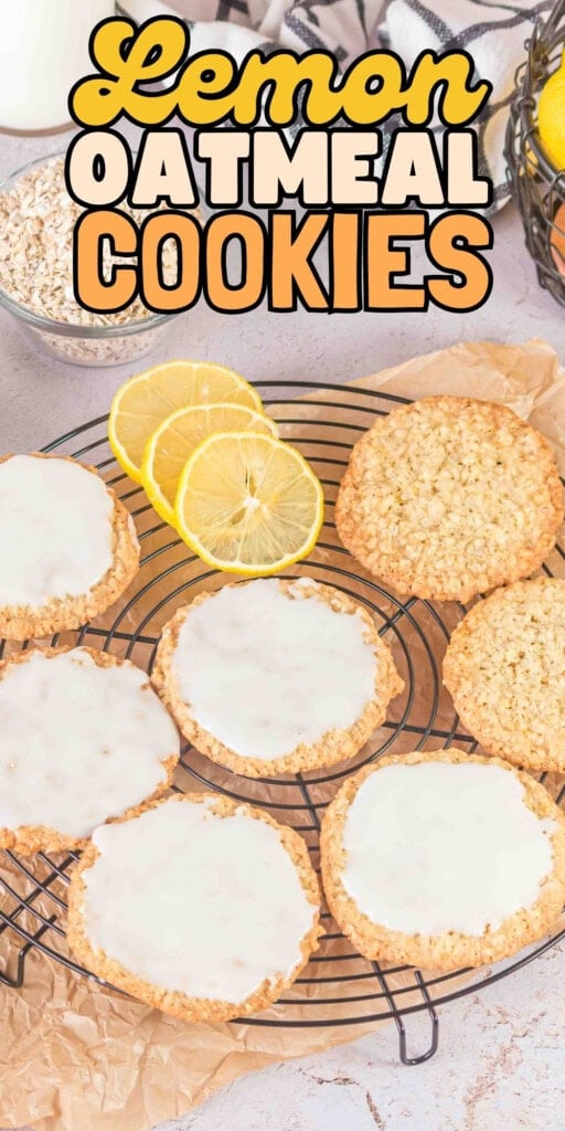 Lemon oatmeal cookies with icing and lemon slices on a cooling rack.