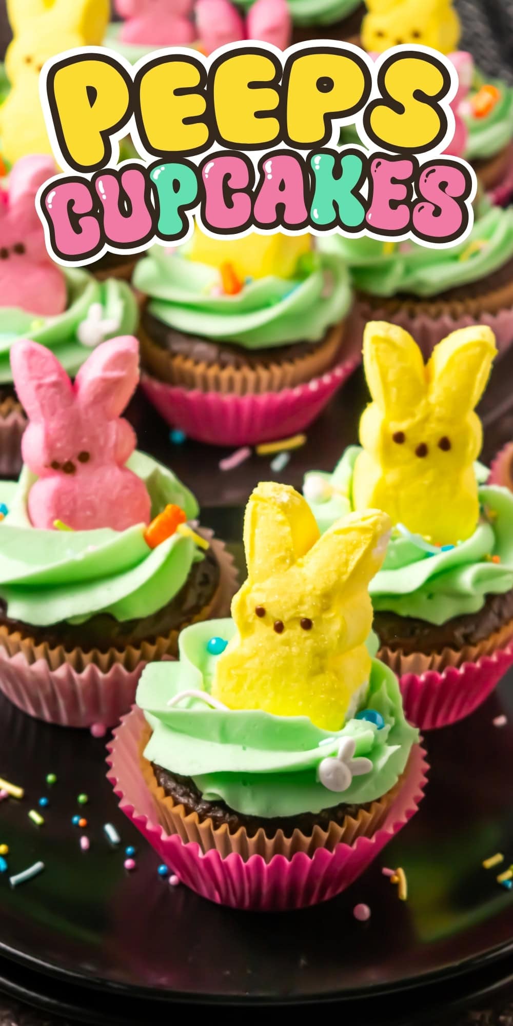 Colorful cupcakes topped with marshmallow bunny Peeps and green frosting.