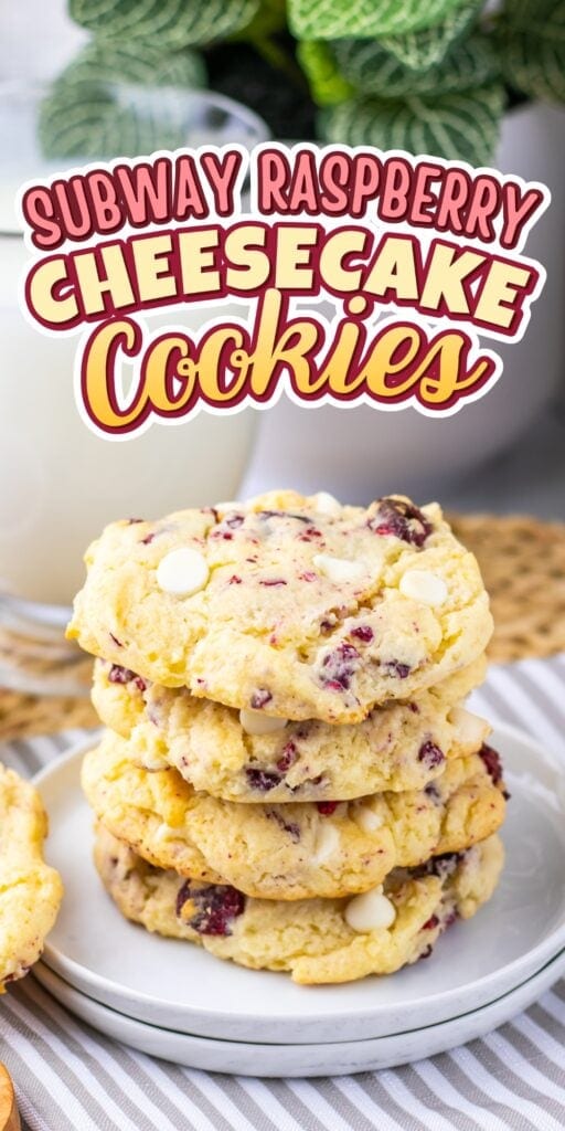 A stack of raspberry cheesecake cookies next to a glass of milk.