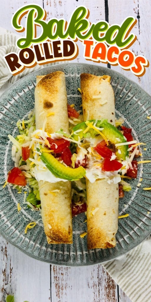 Two baked rolled tacos topped with avocado, cheese, tomato, and sour cream.