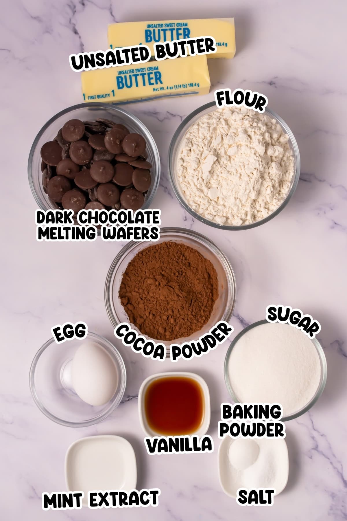 Baking ingredients in bowls labeled: butter, flour, egg, sugar, cocoa, and more.