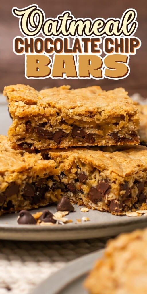 Three thick oatmeal chocolate chip bars stacked on a plate.