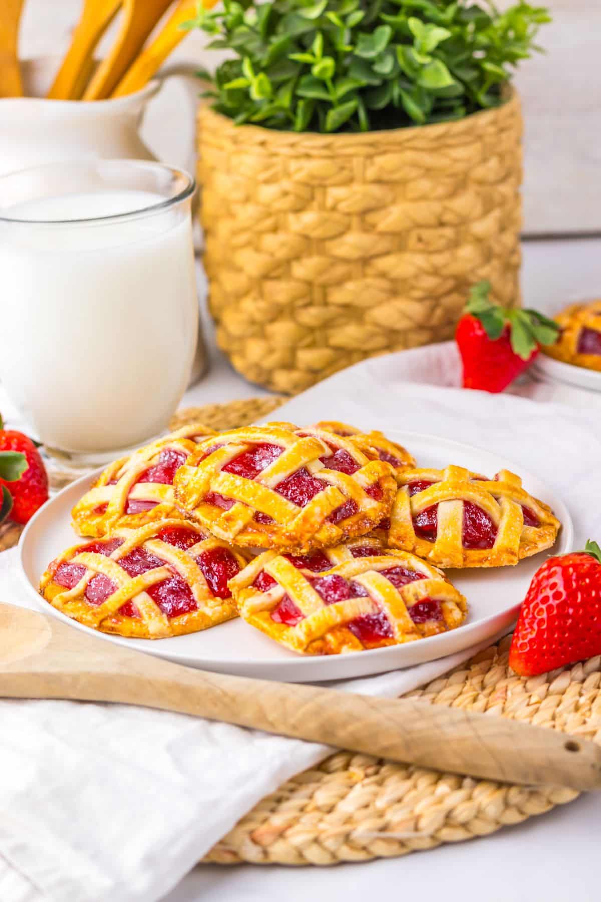 Plate of mini lattice-topped pies&mdash;a must-try for easy strawberry recipes.