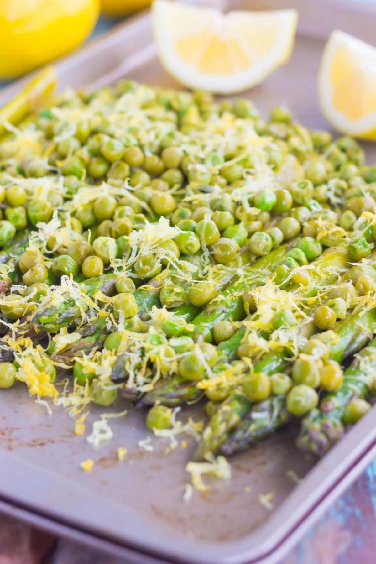 Roasted asparagus with peas and lemon zest&mdash;a spring vegetable recipes favorite.