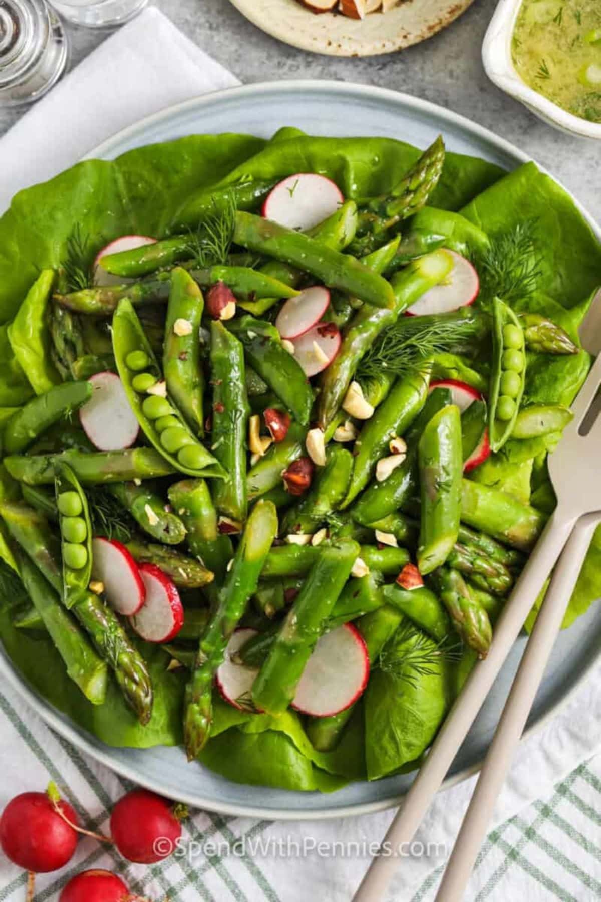 Asparagus, peas, and radishes on greens&mdash;a fresh spring vegetable recipe.