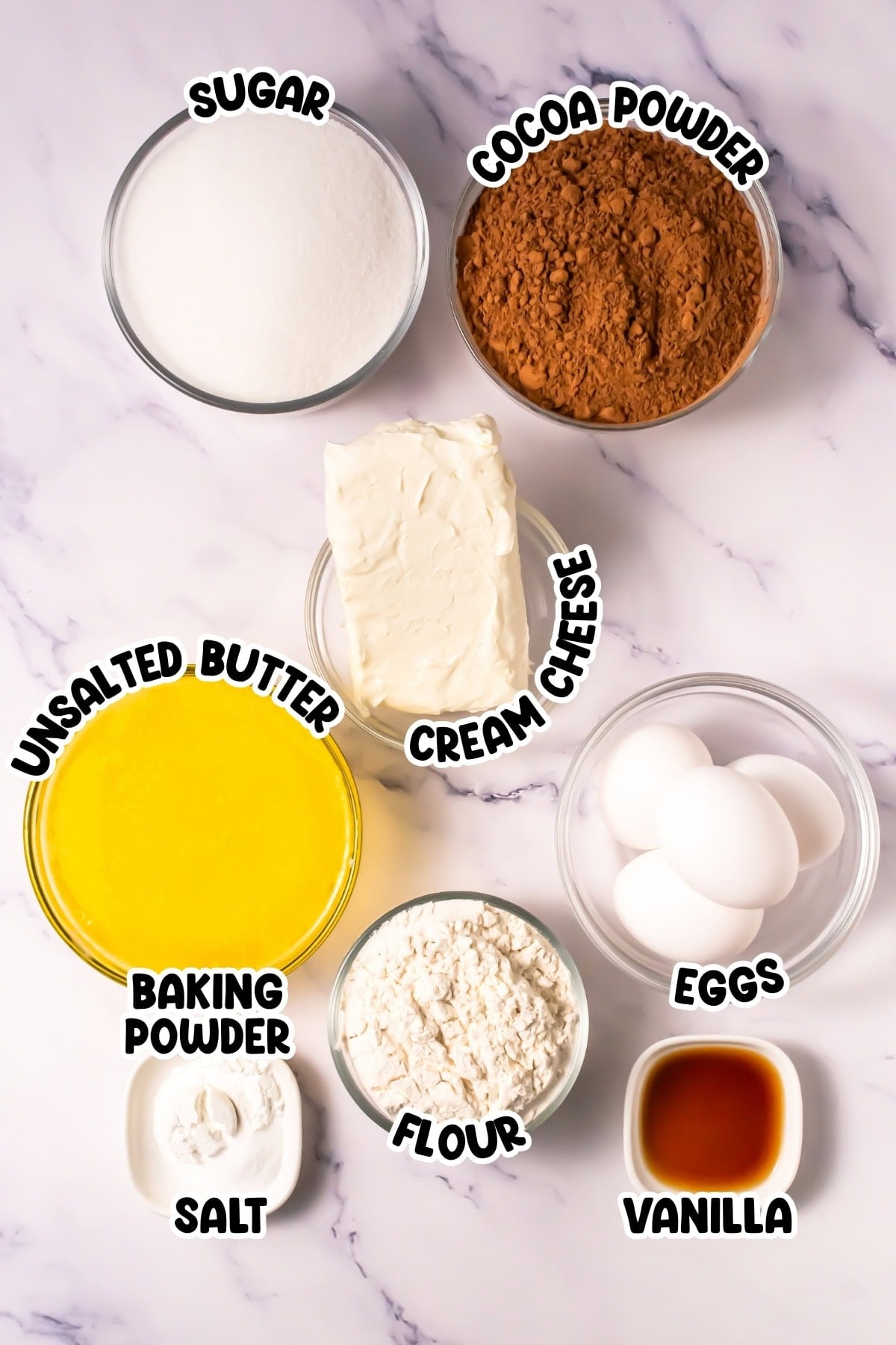 Baking ingredients including sugar, cocoa, butter, cream cheese, eggs, and flour.