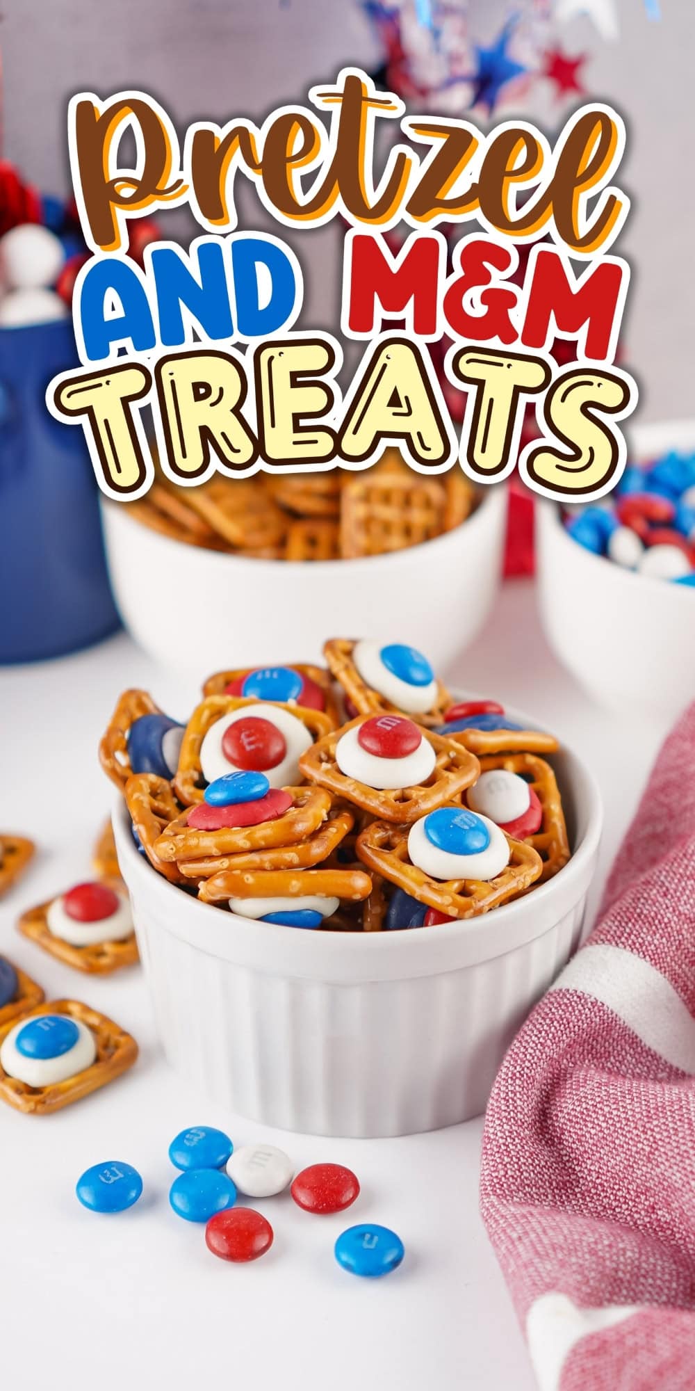 A bowl of pretzel treats topped with red, white, and blue MM candies.