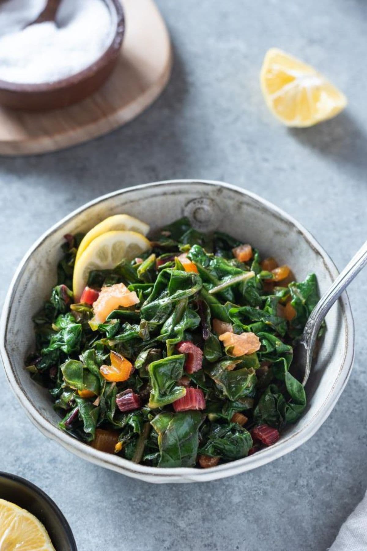 A bowl of saut&eacute;ed leafy greens, perfect for spring vegetable recipes.