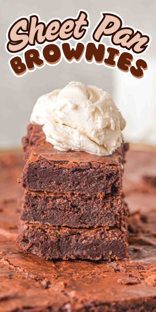 Stack of brownies topped with a scoop of vanilla ice cream.