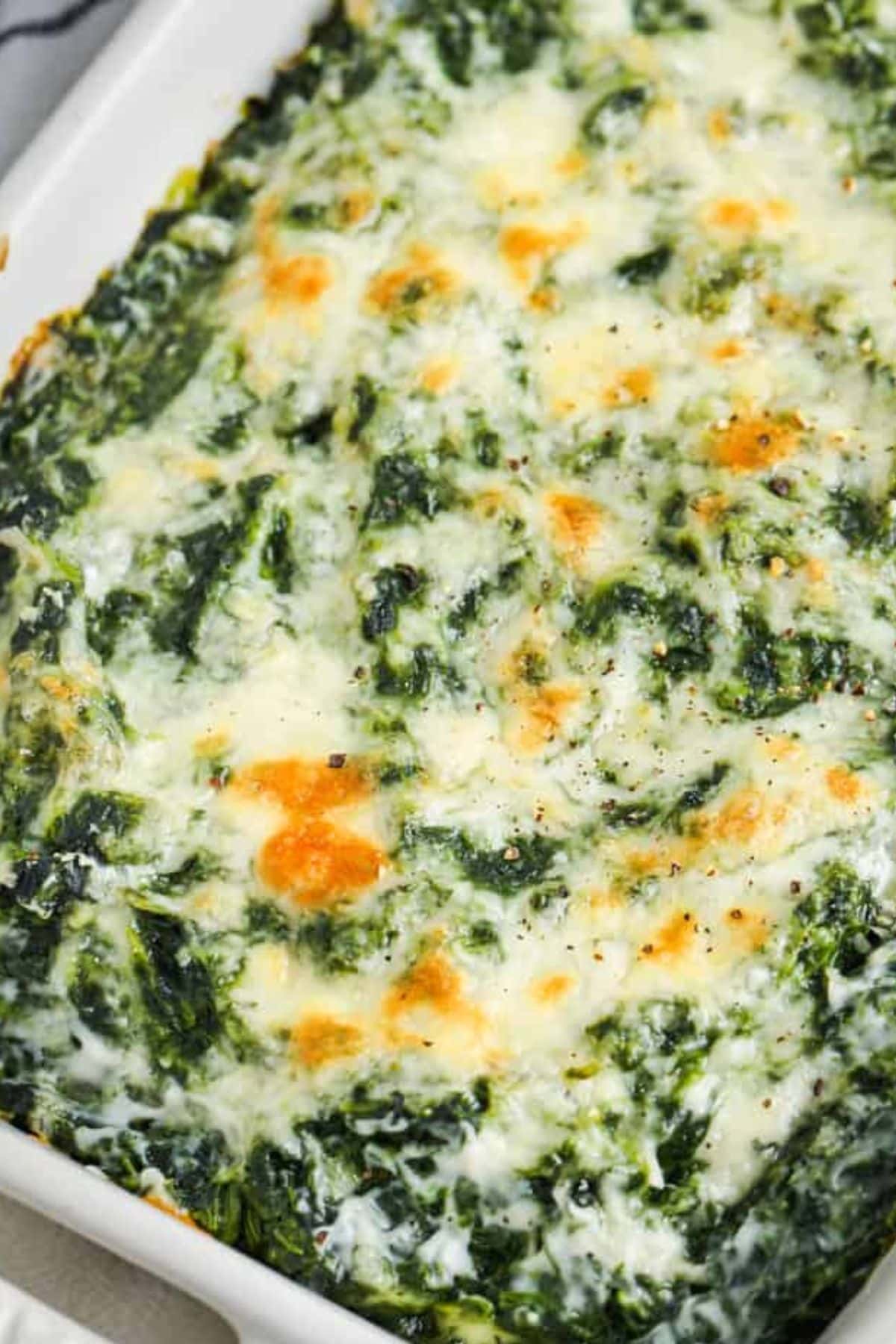 Creamy baked spinach casserole, a standout among spring vegetable recipes.