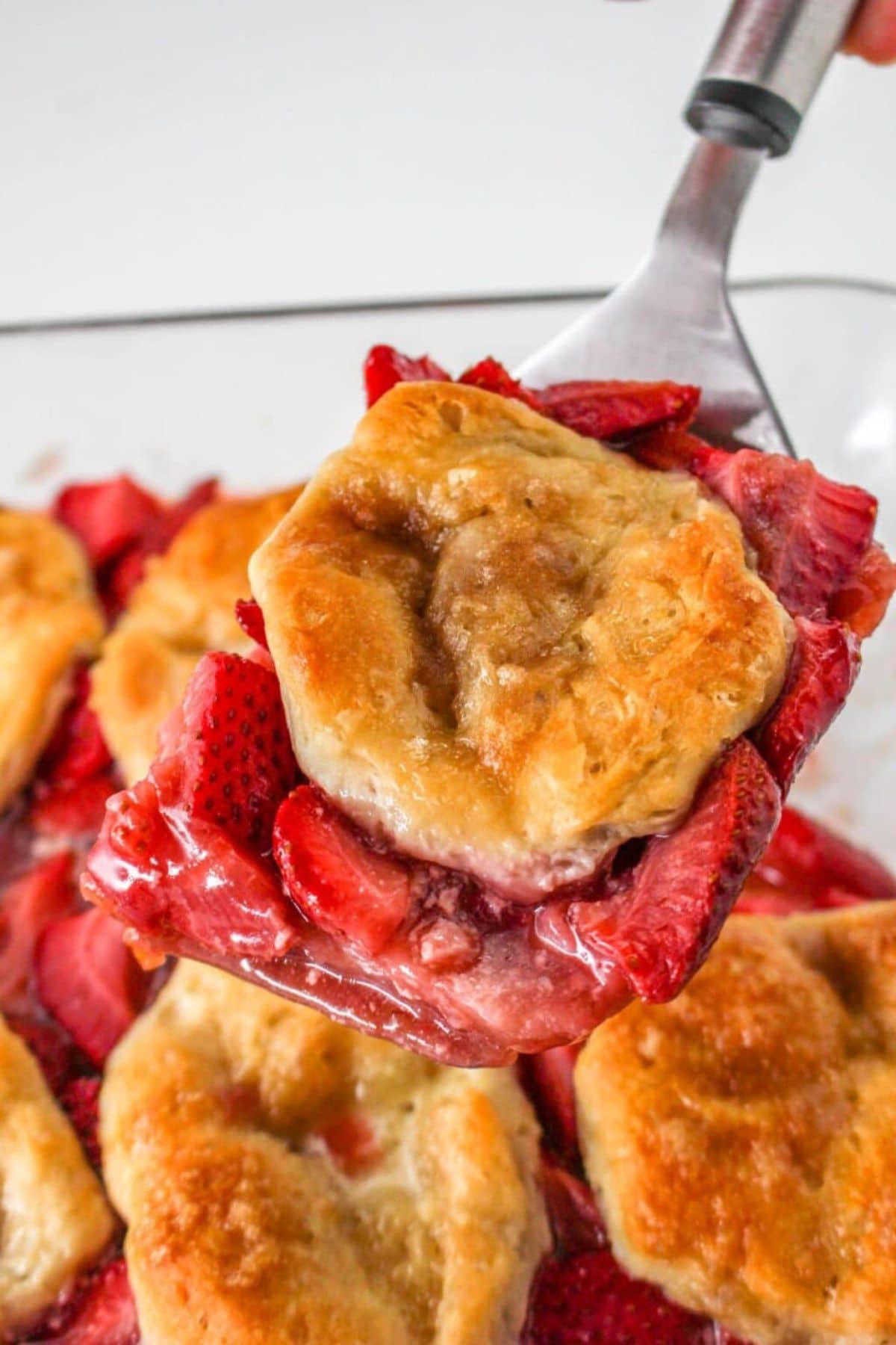 A serving of cobbler with golden-brown topping&mdash;one of our easy strawberry recipes.