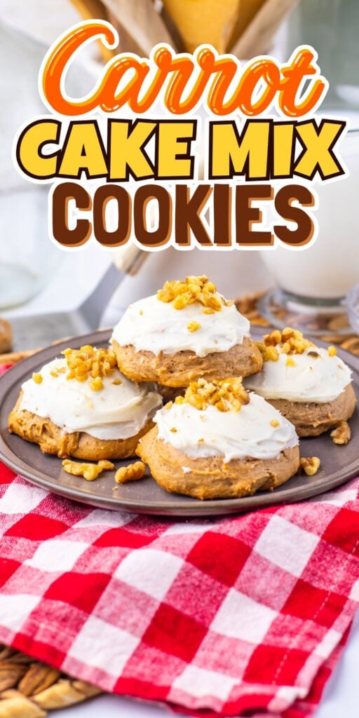 Plate of carrot cake cookies with frosting and nuts on a red checked cloth.