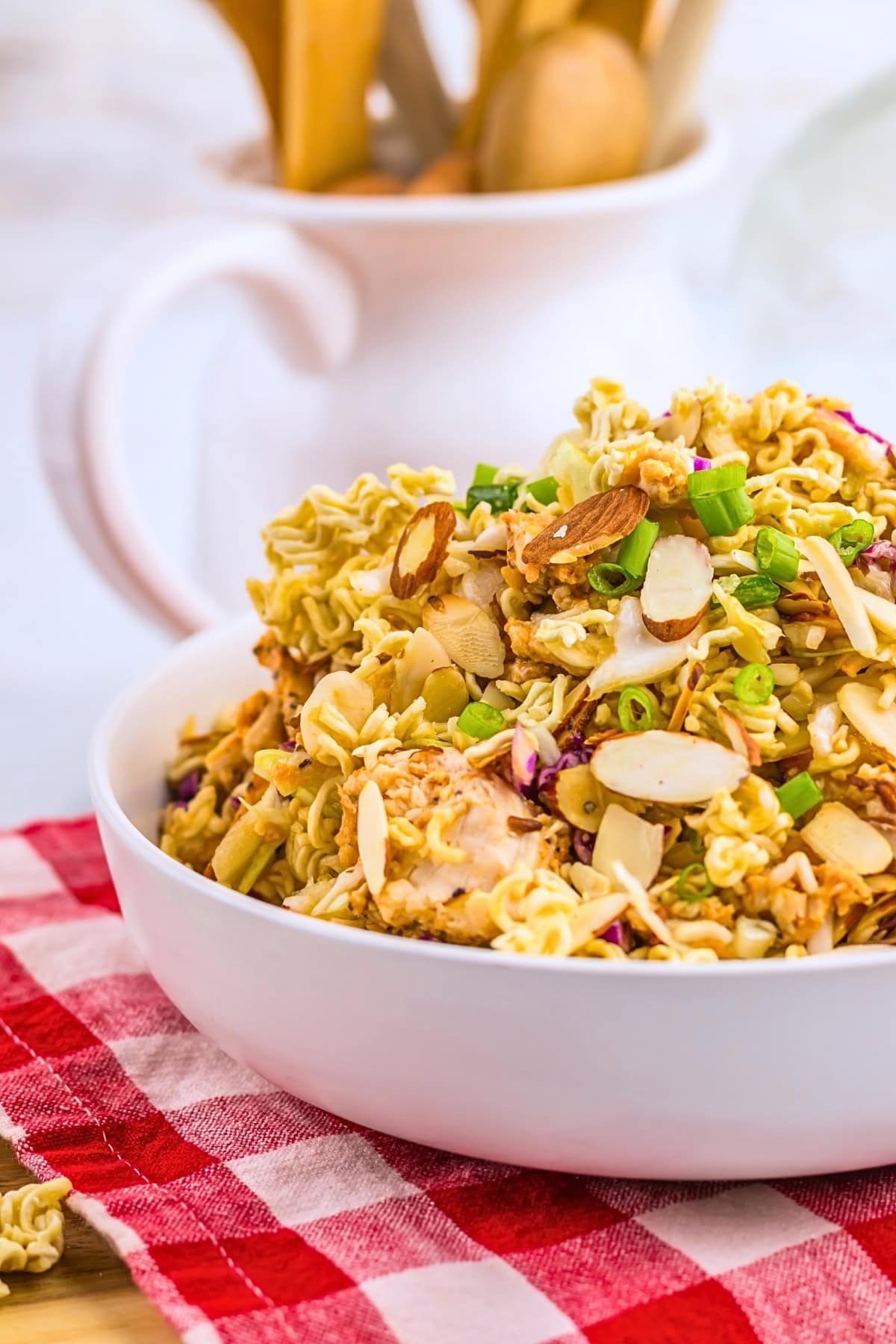Ramen noodle salad with chicken, almonds, and scallions.