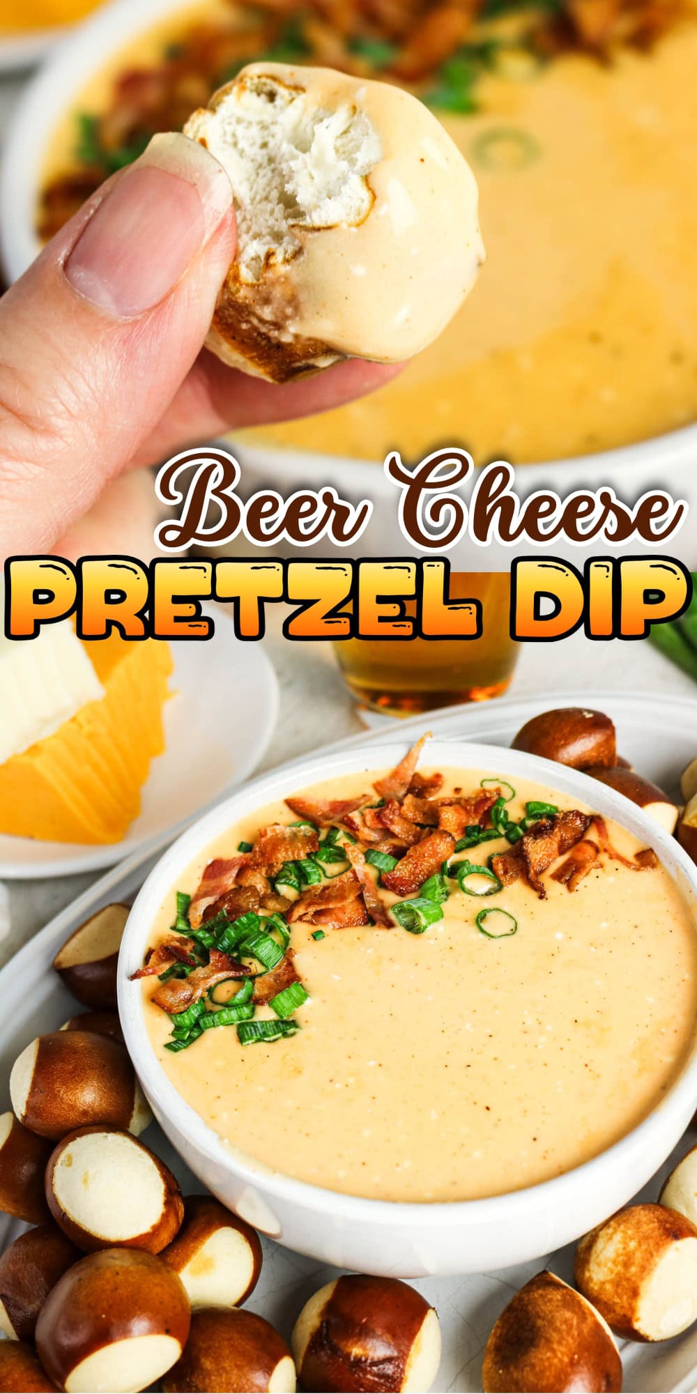 A hand dips a pretzel bite into creamy beer cheese dip garnished with green onions.