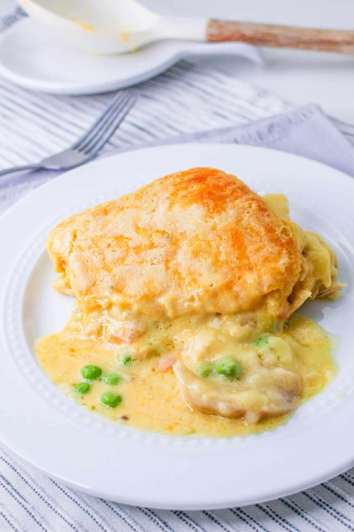 Chicken pot pie inspired by classic chicken casserole recipes on a white plate.
