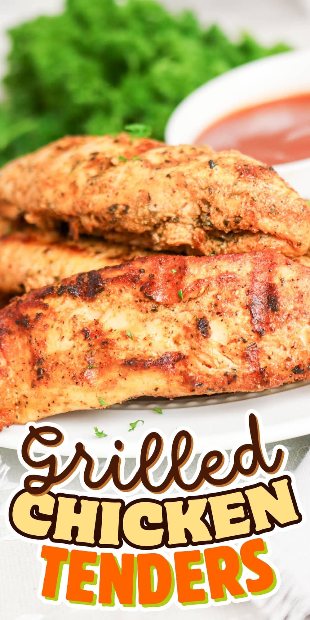 Grilled chicken tenders on a plate with sauce and herbs in the background.