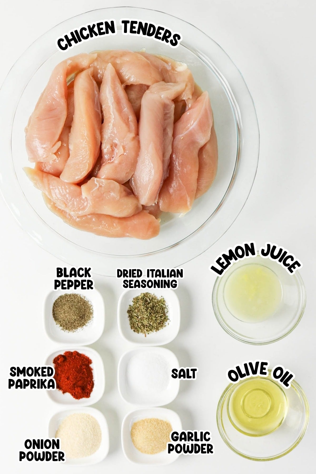 Raw chicken tenders with bowls of spices, lemon juice, and olive oil on a white background.