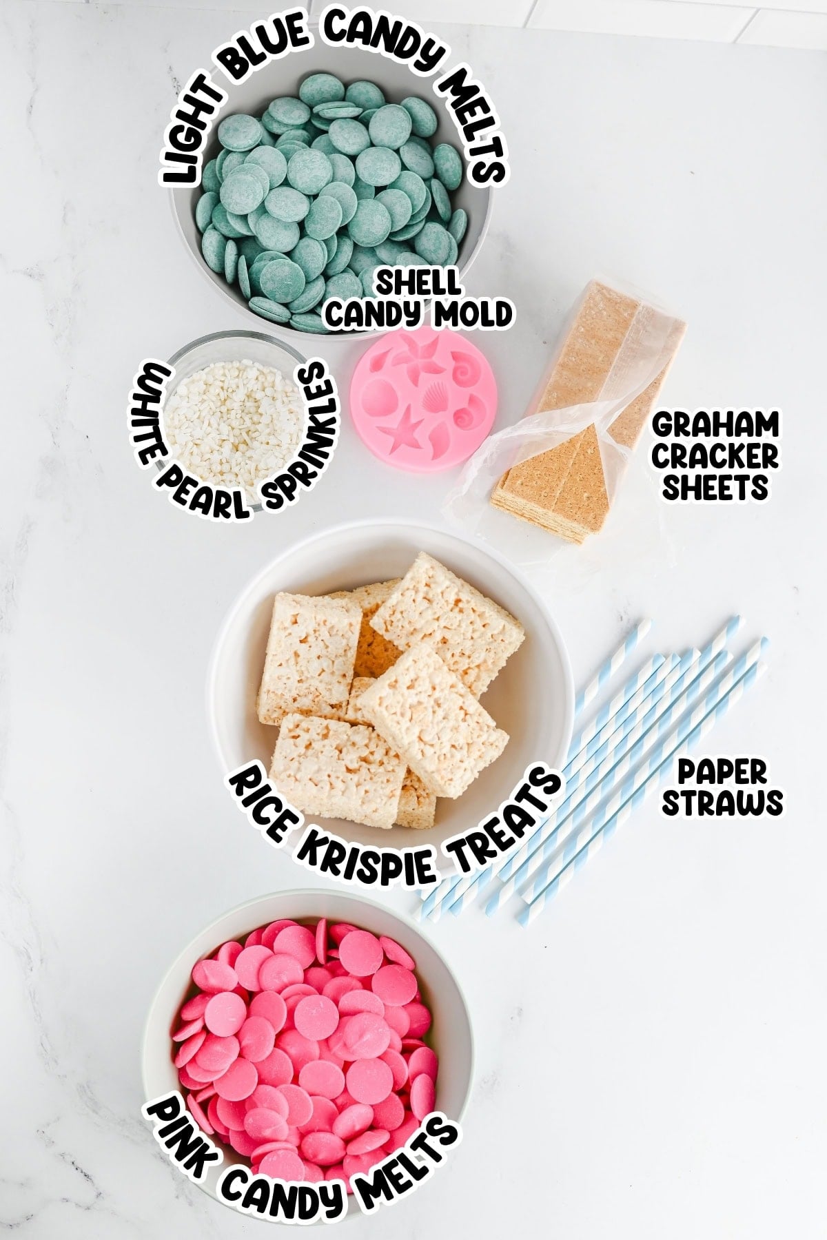 Bowls of candy melts, Rice Krispie treats, sprinkles, graham crackers, and straws.