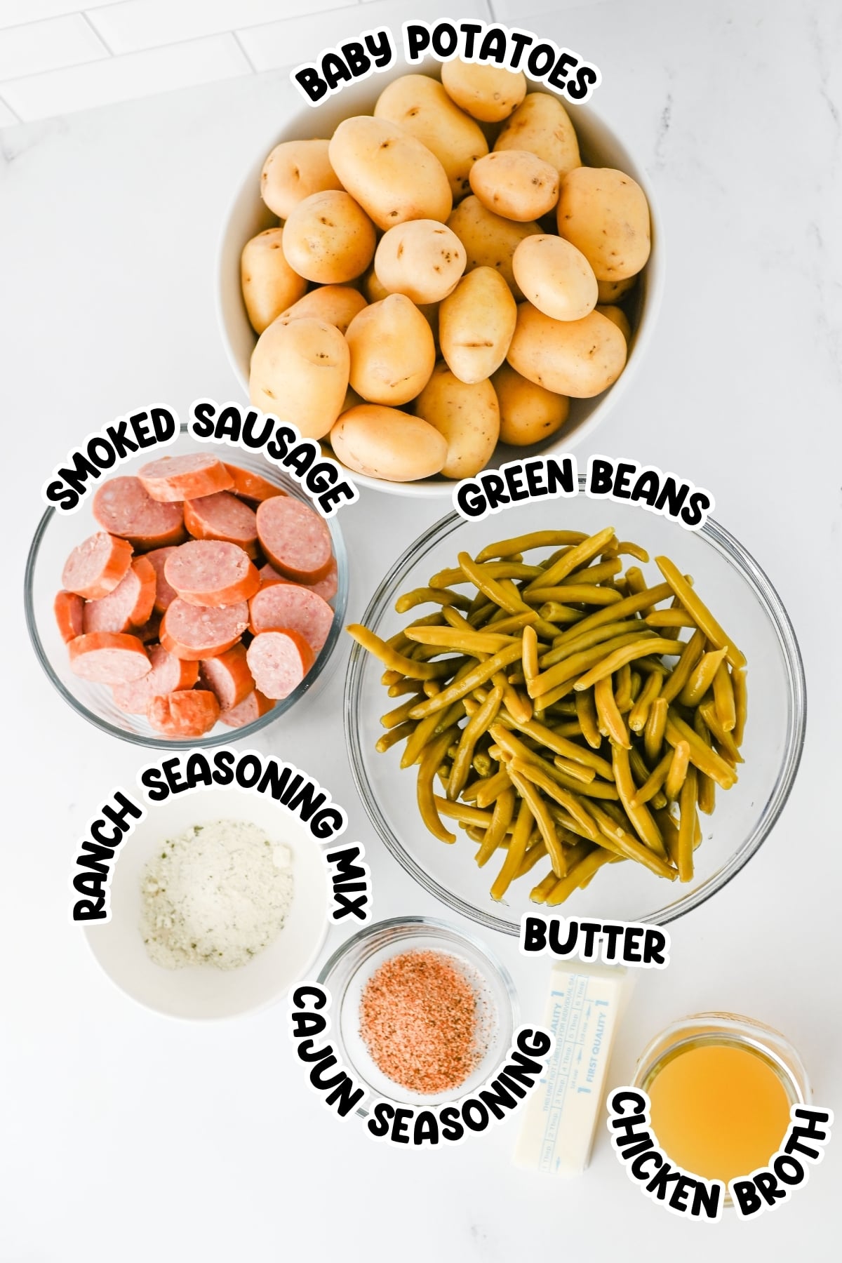 Labeled ingredients: baby potatoes, sausage, green beans, seasonings, butter, broth.
