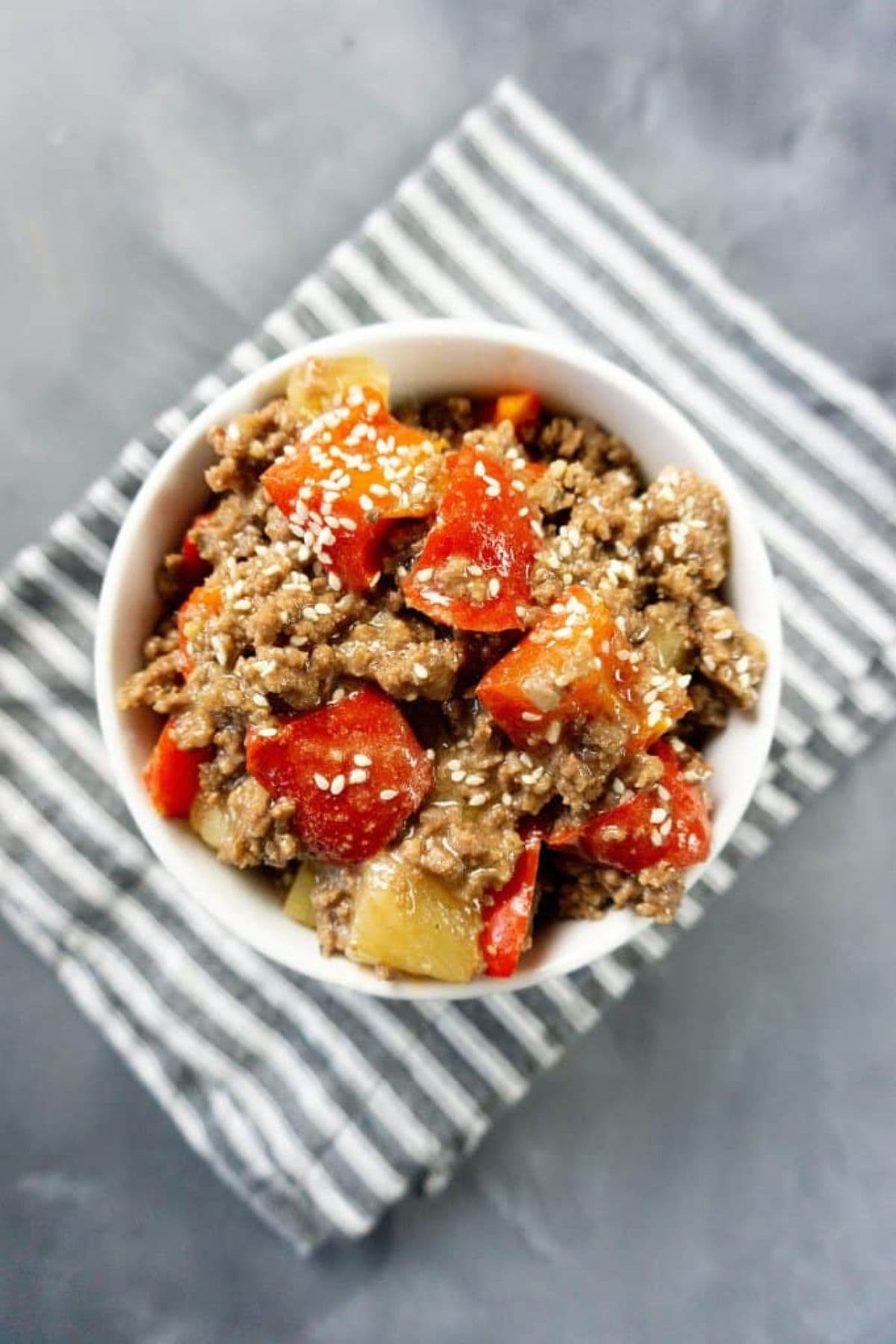 A bowl of stir-fried beef with vegetables, inspired by pineapple recipes.