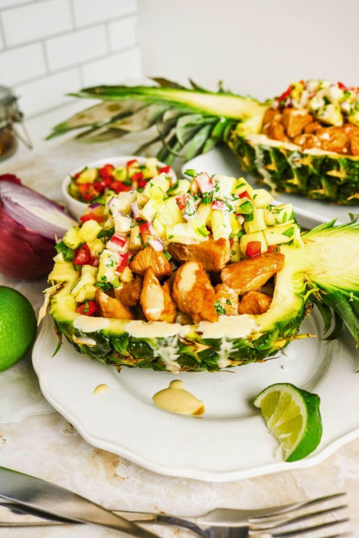 Chicken and salsa in a pineapple bowl—perfect for fans of pineapple recipes.