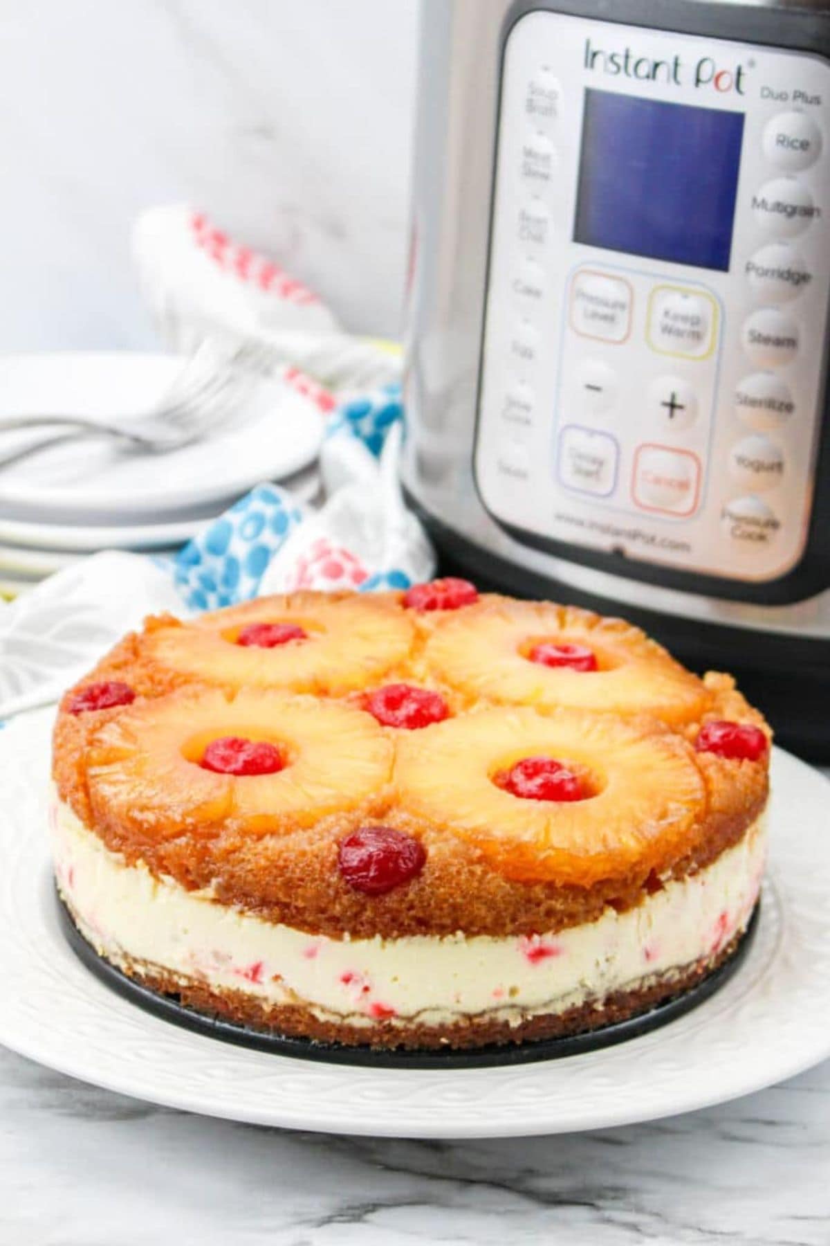Pineapple upside-down cheesecake on a plate, perfect for pineapple recipes lovers.