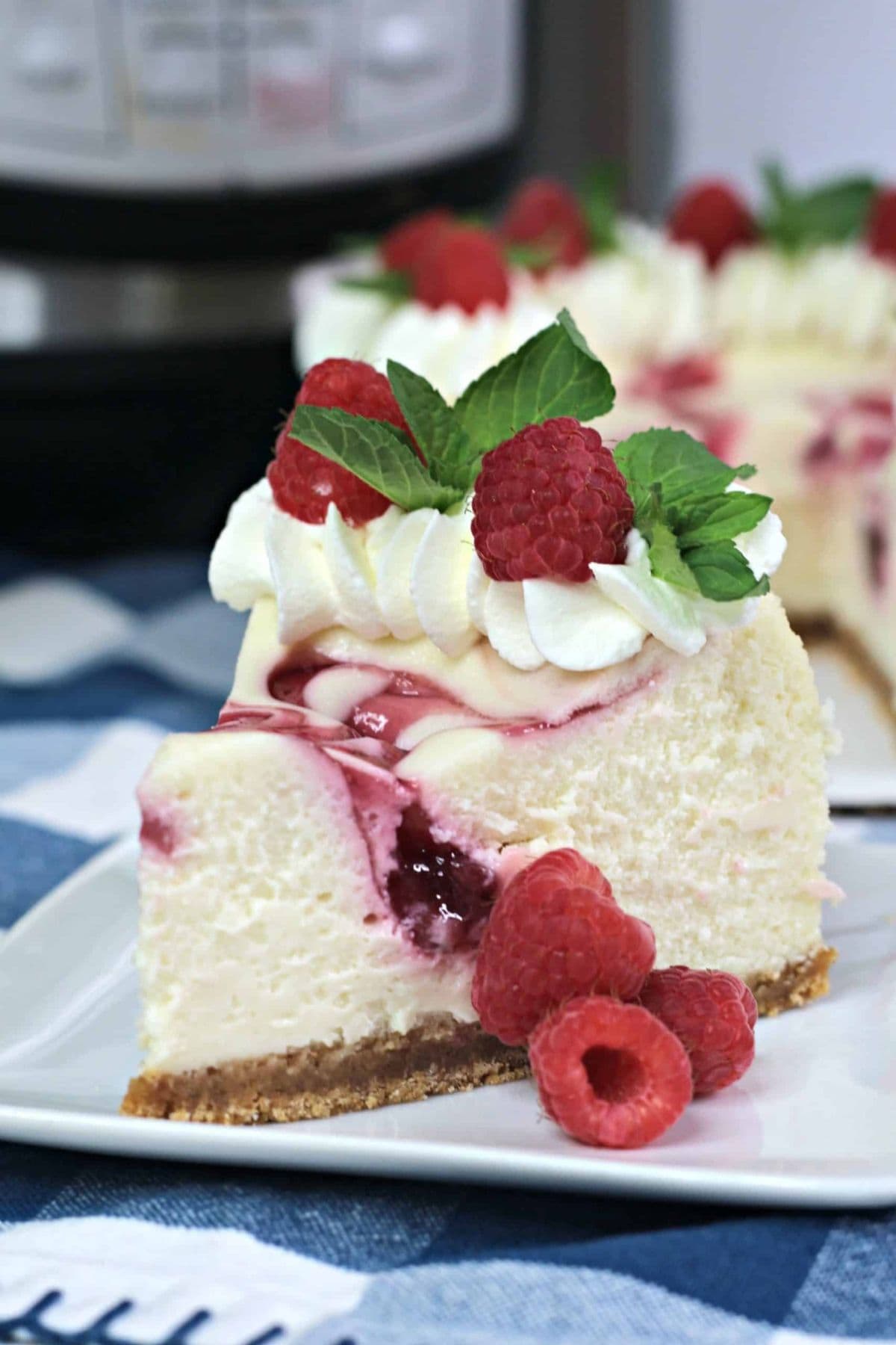 A slice of raspberry cheesecake from our favorite raspberry recipes collection.