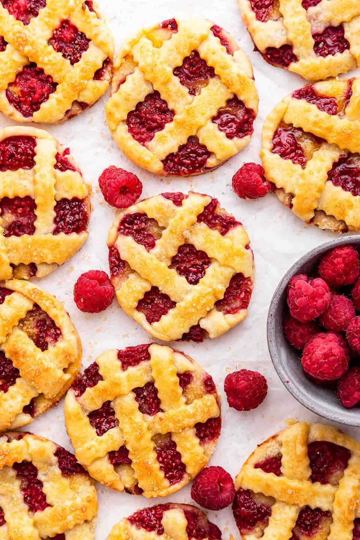 Mini raspberry pies with lattice crusts—perfect for raspberry recipes lovers.