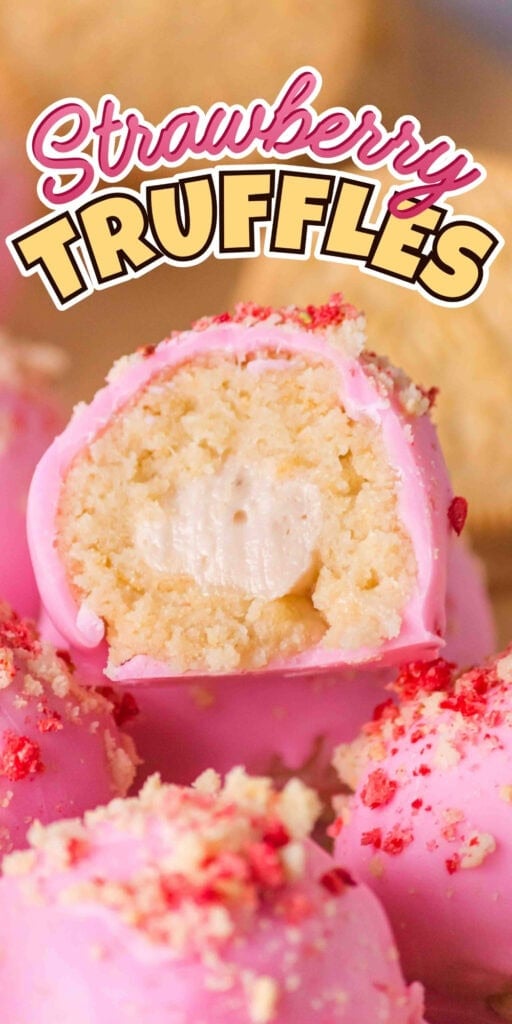Pink strawberry truffles with creamy filling, one truffle cut in half.