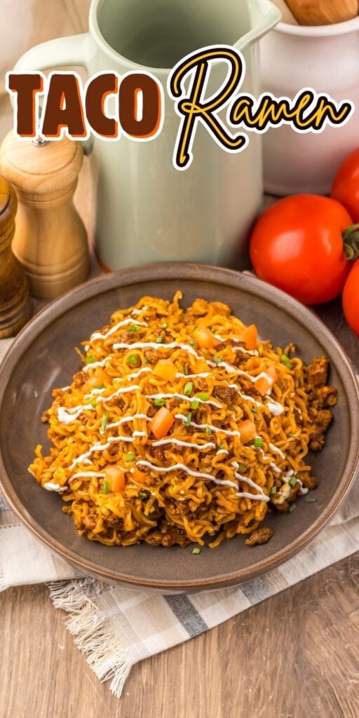 A plate of taco ramen topped with diced tomatoes, sauce, and green onions.