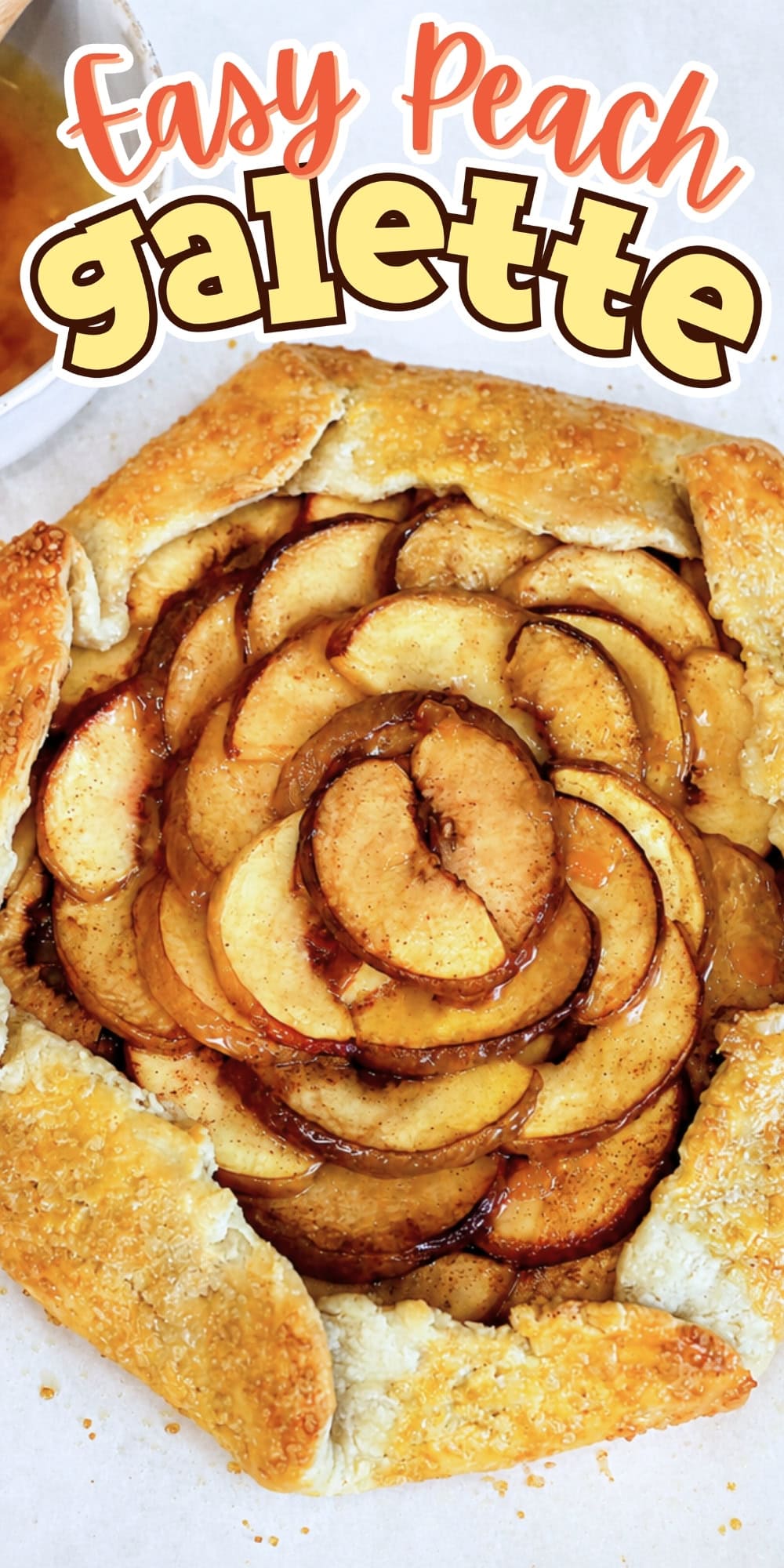 Rustic peach galette with golden crust and cinnamon, labeled Easy Peach galette.