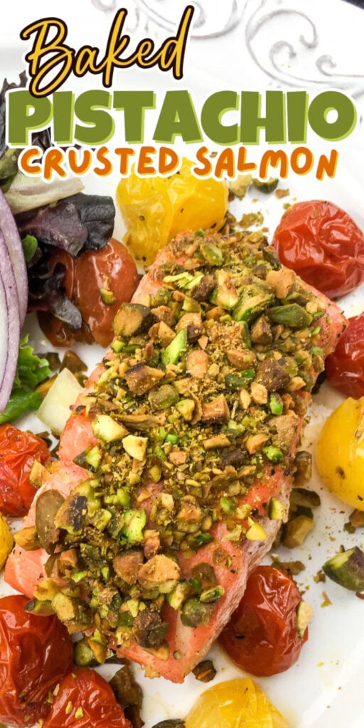Baked pistachio-crusted salmon with cherry tomatoes and mixed greens.